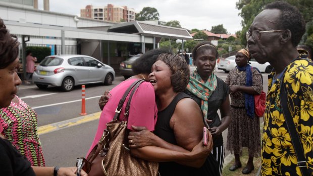 Emotional family members outside Westmead Hospital after crash at Marayong in which three passengers died.
