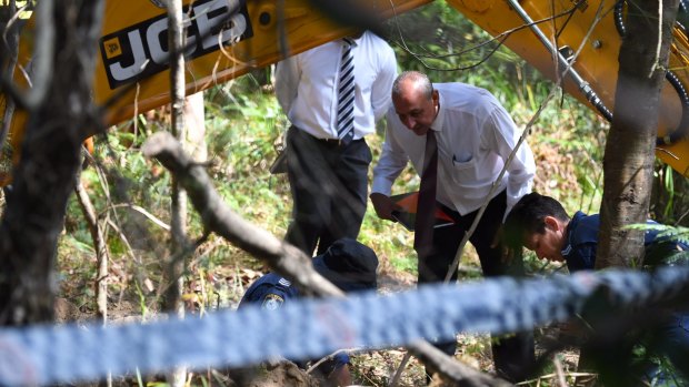 Police used a backhoe to search one of two areas in the Royal National Park in November. 