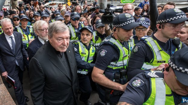Cardinal George Pell arriving at Melbourne Magistrates Court in July.