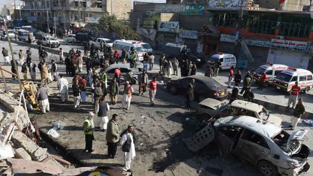 Pakistani security and rescue personnel at the site of a car bomb explosion in Quetta.