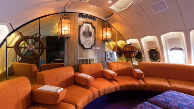 The jumbo jet's upper deck lounge had a nautical theme.