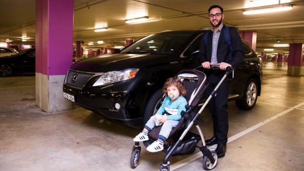 Anthony Serratore, with his 22-month-old son Max, has worked out how to save $180 a month in parking.