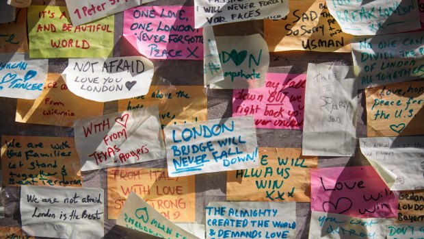 Messages of condolence on a wall at the end of London Bridge.