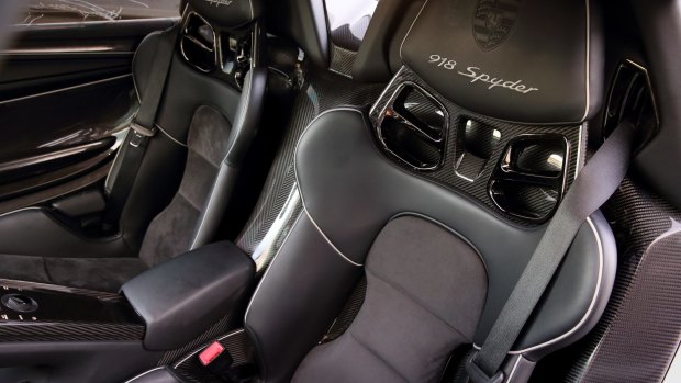 Tightly bolstered carbon bucket seats set the scene.