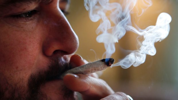 A former US marine smokes medical marijuana in Belfast, Maine.