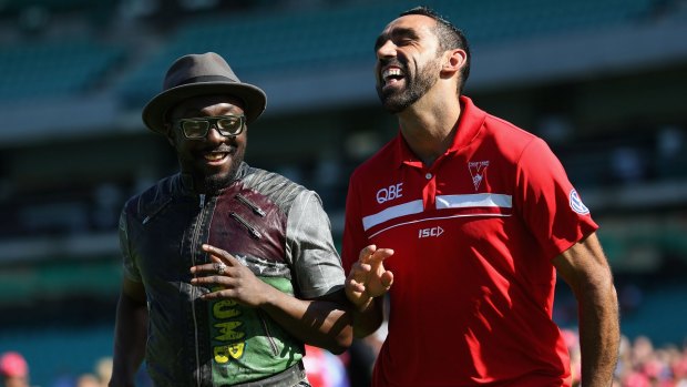 Photo finish:  will.i.am from The Black Eyed Peas with Adam Goodes during a young indigenous AFL players clinic at the SCG.