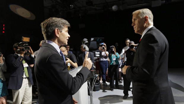 Moderator George Stephanopoulos, left, and North Carolina Republican Senate candidate Thom Tillis, before a debate last year. 