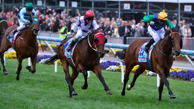 All too easy: Ocean Park, centre, takes the Cox Plate ahead of All Too Hard, rails, in 2012.