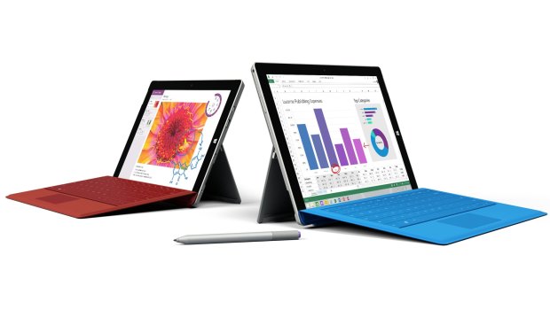 The Surface 3, left, with its larger sibling the Surface Pro 3 and the Surface Pen.
