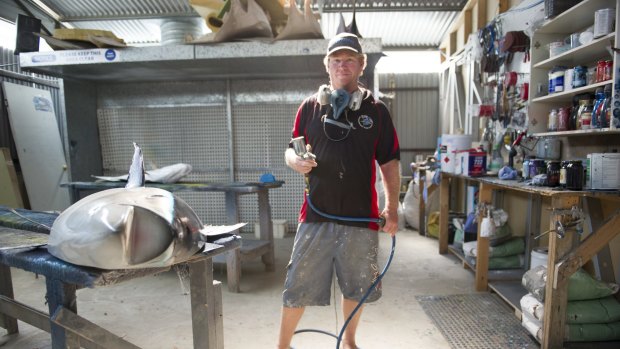 Scott Mann of Batemans Bay crafts fibreglass fish created from moulds of prize catches.