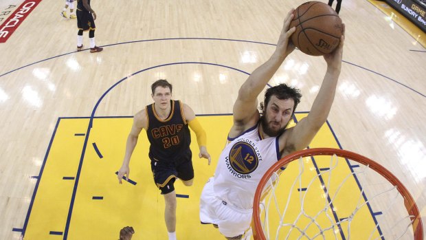 Back in national colours: Golden State Warriors centre Andrew Bogut dunks against the Cleveland Cavaliers during the NBA Finals.