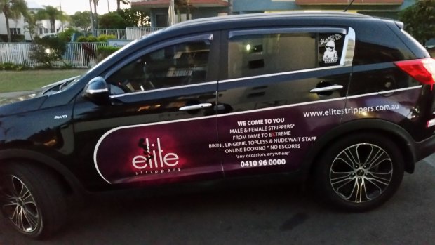 Elite Strippers are advertising on the side of a car used for Uber