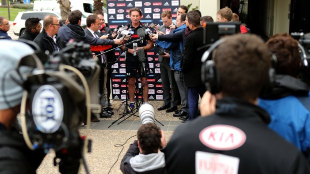 James Hird is surrounded by media during an Essendon recovery session at St Kilda on Tuesday.