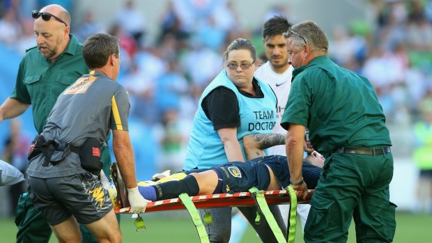 Horrific injuries: Mariners defender Storm Roux is stretchered from the field.