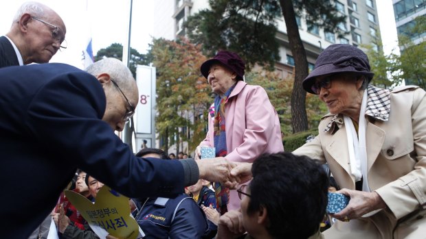 Japanese pastors greet Kim Bok-dong in an act of repentance and reconciliation.