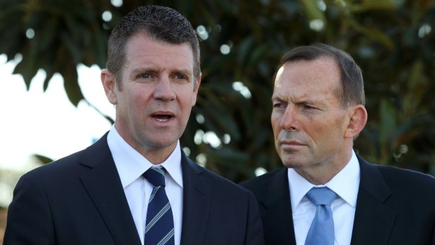 Facing a rapidly growing list of political challenges: Tony Abbott and Mike Baird.