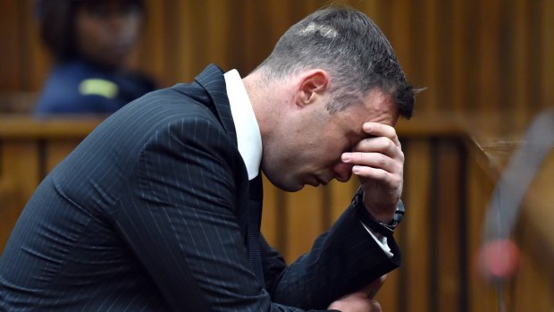 Oscar Pistorius with his head in his hands as he faces the High Court in South Africa.