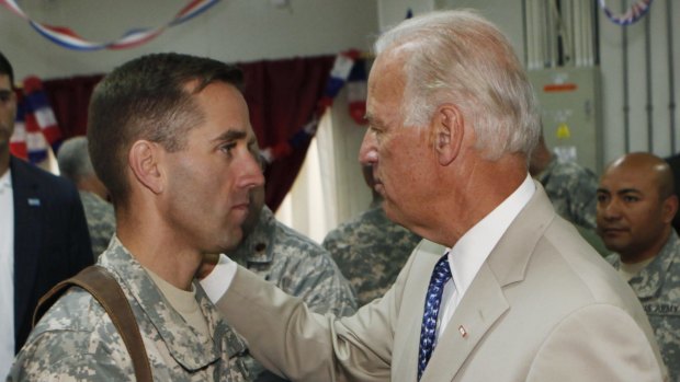 US Vice President Joe Biden, right, talks with his son, then US Army Captain Beau Biden, at Camp Victory on the outskirts of Baghdad, Iraq in 2009. 
