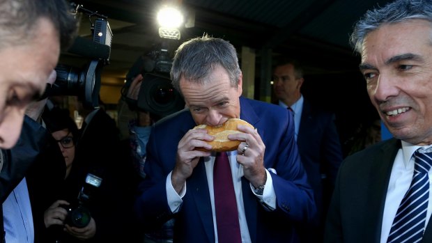 The controversial moment as Bill Shorten bites into a sausage sizzle...from the side.