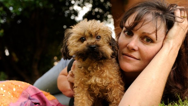 Oscar's Law founder Debra Tranter with five-year-old Oscar, who she rescued from a puppy farm. 
