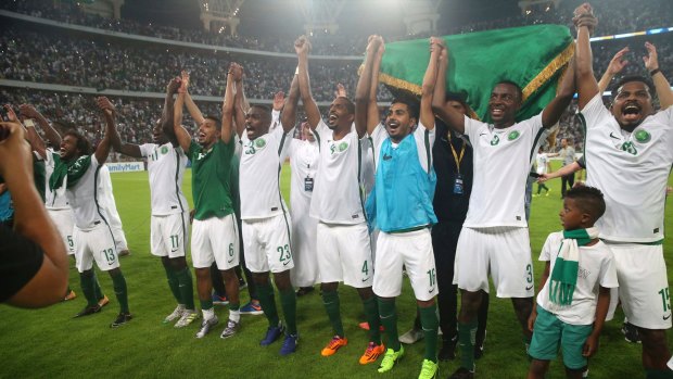 Saudi Arabia players take in the moment after reaching the World Cup finals. Photo: AP