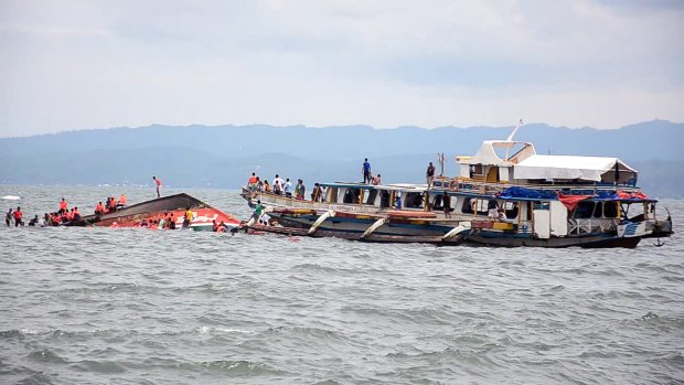 The Philippine Coast Guard rescues boat passengers after a ferry boat capsized in choppy waters in Ornoc, Philippines.