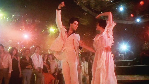 John Travolta as Tony Manero and Karen Lynn Gorney as Stephanie light up the dance floor in Saturday Night Fever.