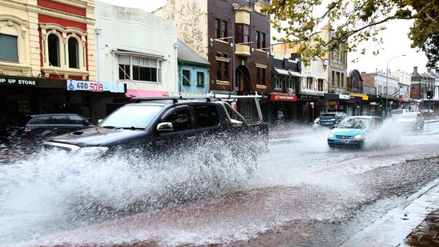 Epic journey: Drivers negotiate Oxford Street, Paddington during the Sydney storms.