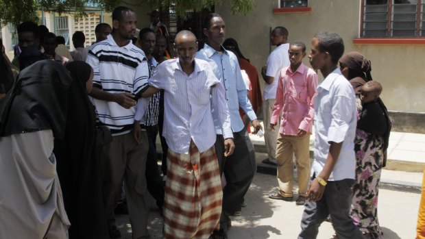 One of the survivors of the university attack, centre, at the Garissa Hospital.
