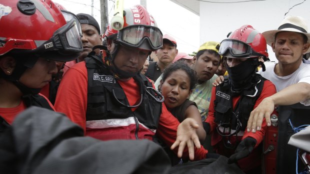 Relatives of the missing demand information from firefighters in Pedernales, Ecuador.