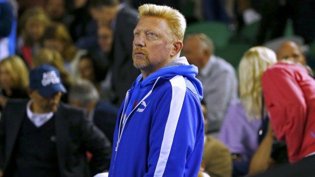 Novk Djokovic's coach, former German ace Boris Becker, watches the game.