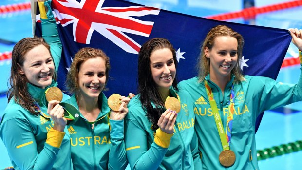 Golden girls: Australia's 4x100m freestyle relay team celebrate with their medals.