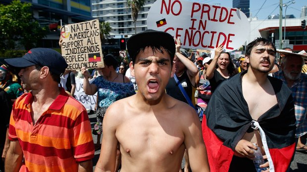 A man shouts slogans about Aboriginal rights in Australia during a protest against G20 leaders in Brisbane in 2014.