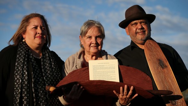 Megan Davis (left) and Pat Anderson from the Referendum Council holding the Uluru <I>Statement from the Heart</I> with Noel Pearson.