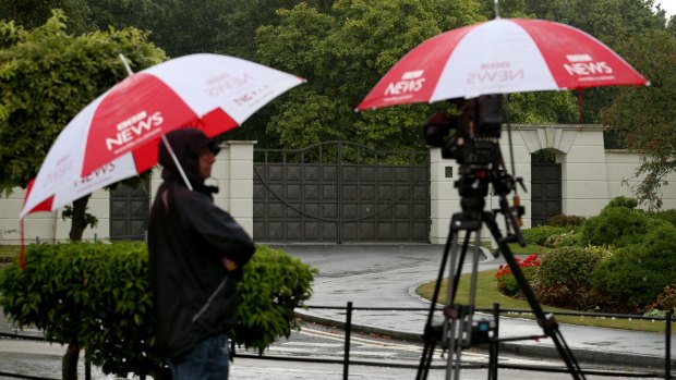 A BBC crew at the gates of Sir Cliff's apartment complex in August.