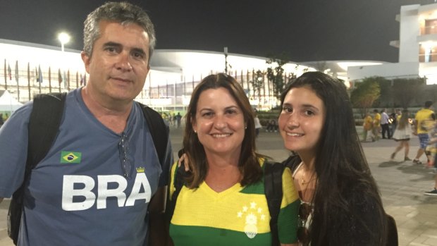 Father Joao, mother Arlene and daughter Paula, at Olympic Park, have different views on booing.