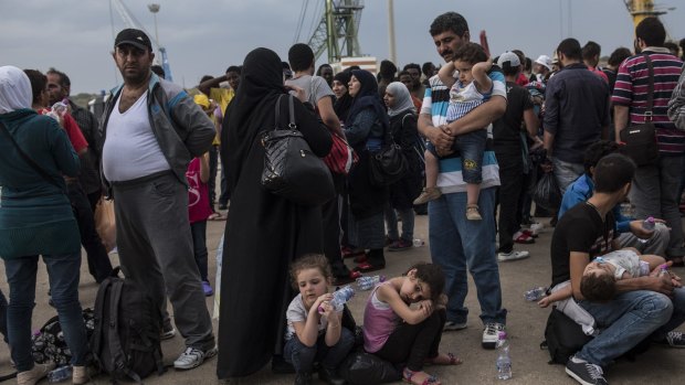 Asylum seekers arrive in Sicily.