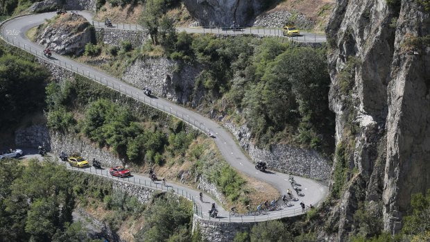 The group with Britain's Chris Froome, wearing the overall leader's yellow jersey, climbs Montvernier hairpins during the eighteenth stage.