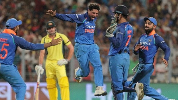India's Kuldeep Yadav celebrates after taking his third wicket.