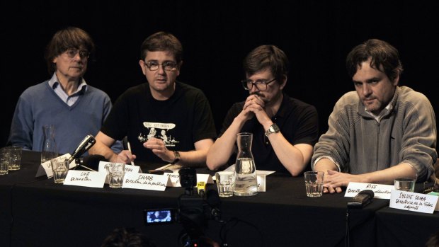 Charlie Hebdo satirical newspaper cartoonists Cabu, Charb, Luz and Riss give an editorial conference at the Theatre du Rond-point in Paris, one day after the publication's offices were destroyed in a petrol bomb attack on November 3, 2011.