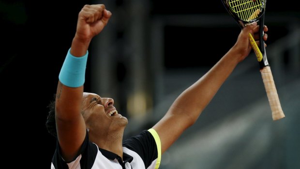 Kyrgios celebrates his victory over Federer at the Madrid Open.