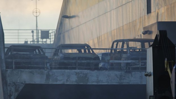 Torched cars on the deck of the ferry.