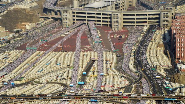 Hundreds of thousands of pilgrims make their way to cast stones at a wall symbolising Satan, in Mina on the outskirts of the holy city of Mecca on September 24, the day of the fatal stampede.