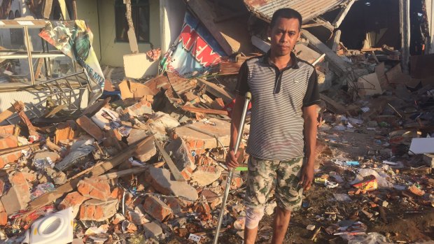 Faisal Marwan amid the wreckage in Trienggadang.