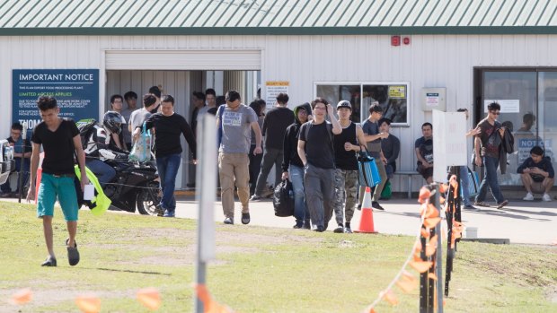 Workers leave the Thomas Foods meat processing plant after their shift finishes in Westdale, near Tamworth.