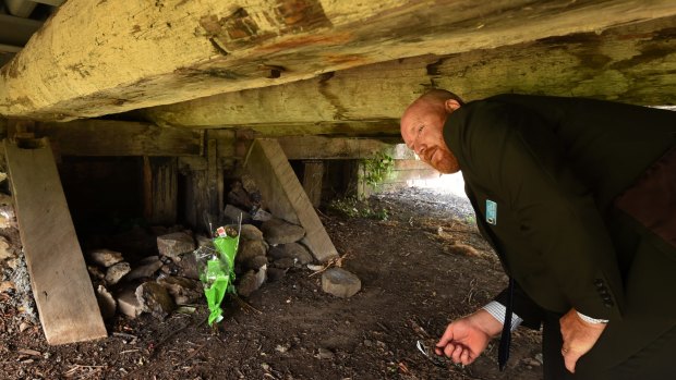 Detective Senior Constable Adrian Graham stands near the shelter where Reginald Mullaly's body was found.