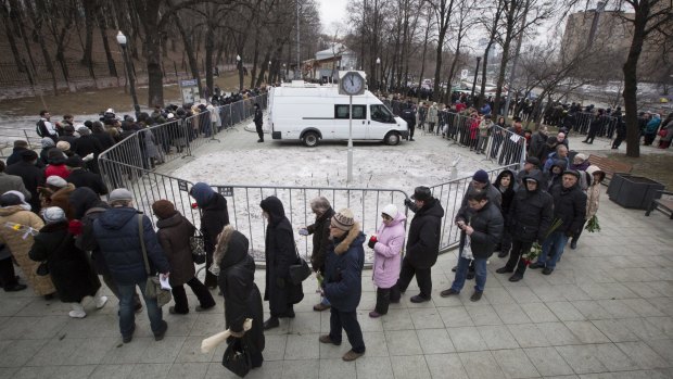 People line up to pay their last respects at the coffin of Boris Nemtsov inside the Sakharov centre in Moscow.