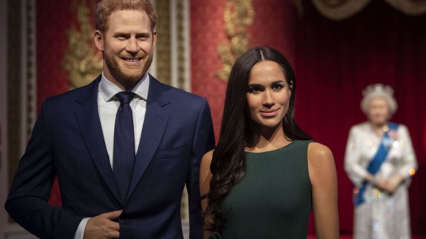 The figures of Britain's Prince Harry and Meghan, Duchess of Sussex.