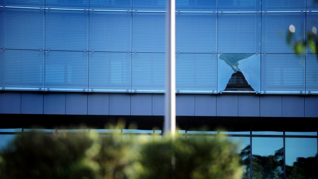 Glass panes continue to drop from the ASIO building in Parkes Way.
