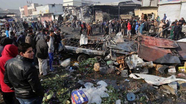 The scene after a car bomb explosion at a crowded outdoor market in eastern Baghdad.